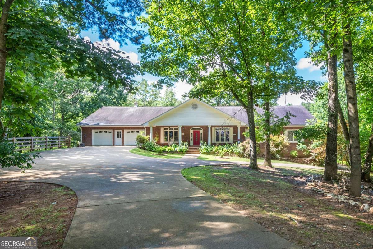755 Harris Road Jasper, GA 30143 - Photo 17 of 62 a front view of a house with a garden