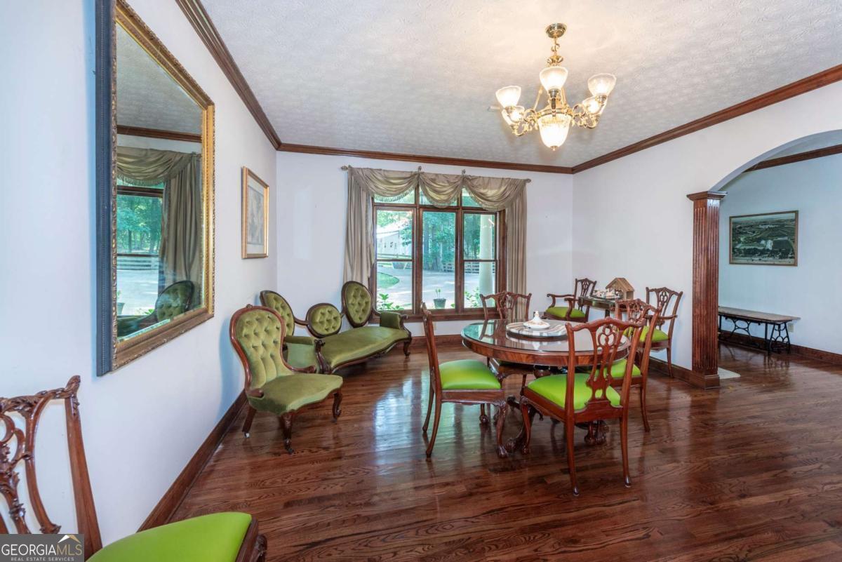 755 Harris Road Jasper, GA 30143 - Photo 22 of 62 a living room with furniture and a chandelier