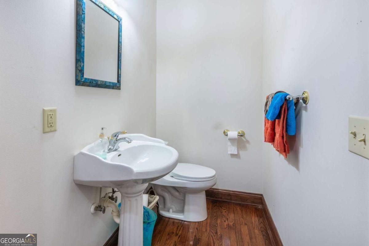 755 Harris Road Jasper, GA 30143 - Photo 26 of 62 a bathroom with a toilet sink and mirror