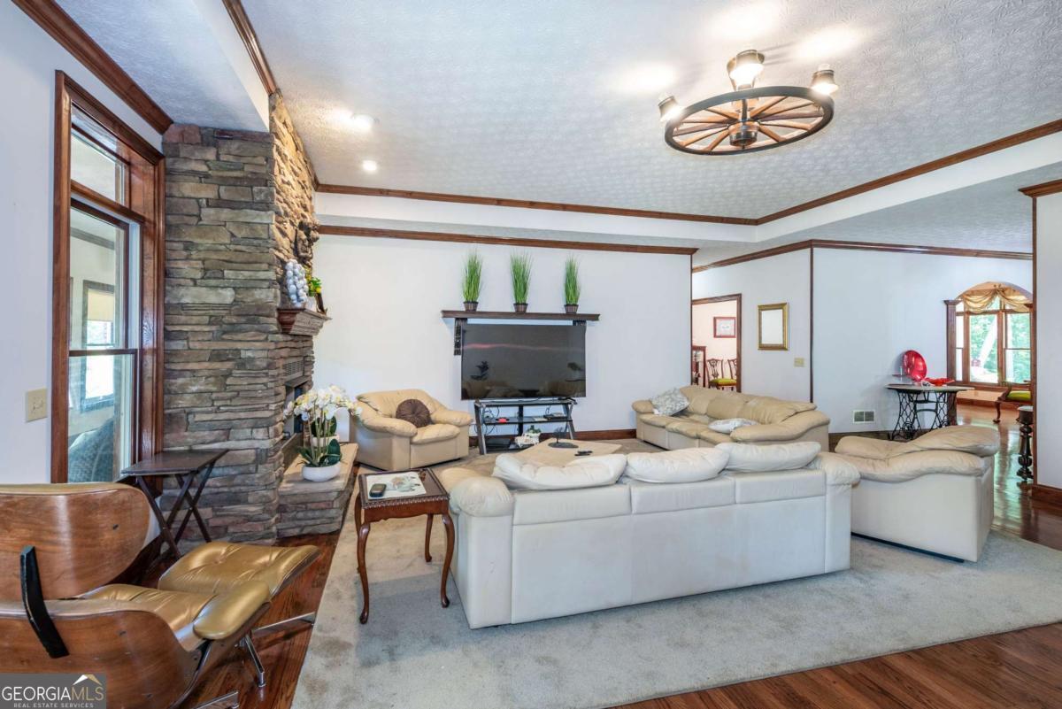 755 Harris Road Jasper, GA 30143 - Photo 32 of 62 a living room with furniture and a flat screen tv