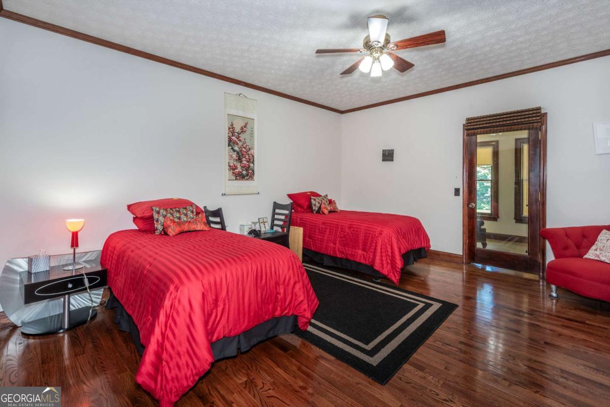 755 Harris Road Jasper, GA 30143 - Photo 35 of 62 a bedroom with bed and a chandelier