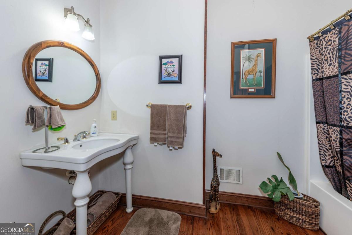755 Harris Road Jasper, GA 30143 - Photo 36 of 62 a bathroom with a sink and a mirror