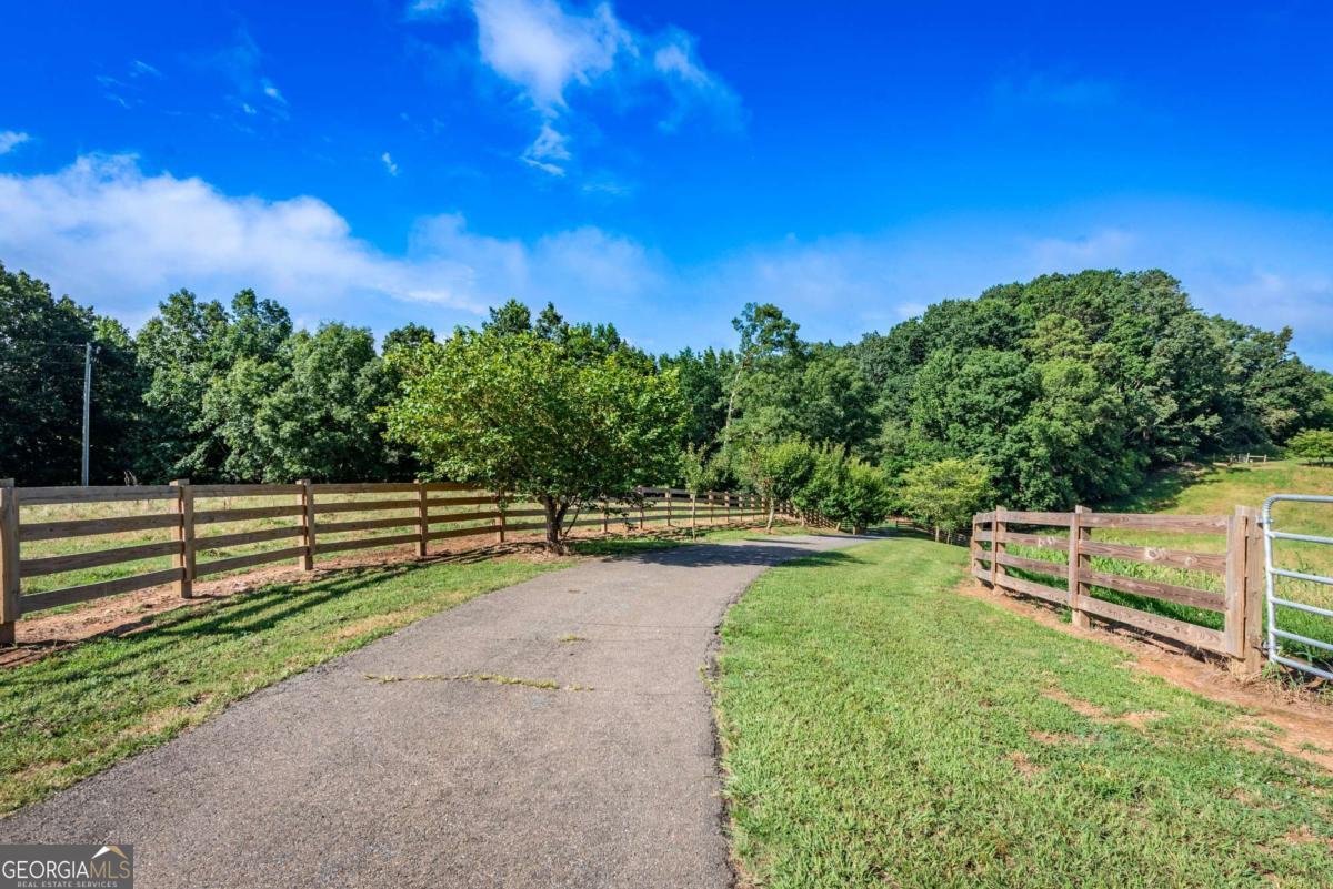 755 Harris Road Jasper, GA 30143 - Photo 4 of 62 a view of a yard with wooden fence