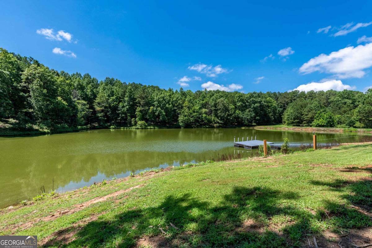755 Harris Road Jasper, GA 30143 - Photo 48 of 62 a view of a lake with a big yard