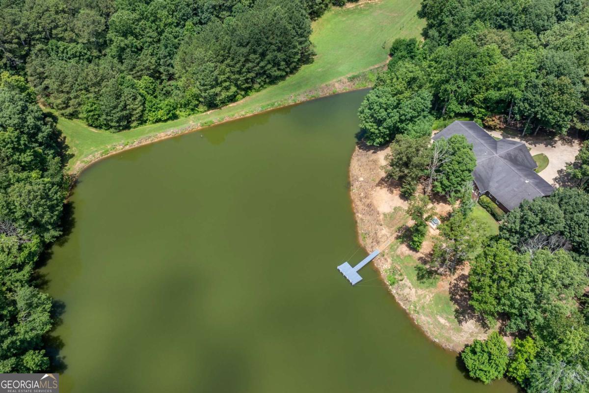 755 Harris Road Jasper, GA 30143 - Photo 56 of 62 an aerial view of a house with a yard and lake view