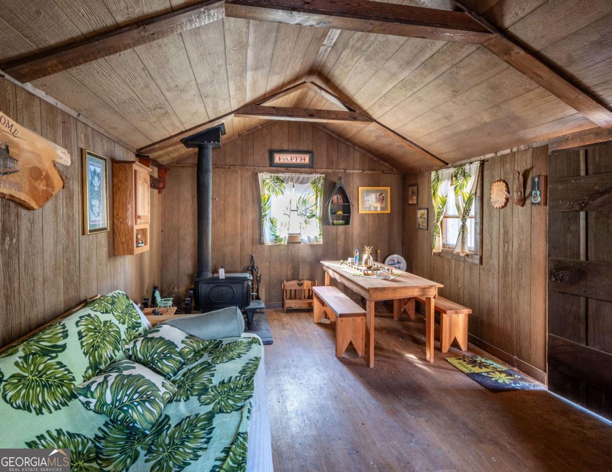 755 Harris Road Jasper, GA 30143 - Photo 60 of 62 a living room with furniture and a chandelier