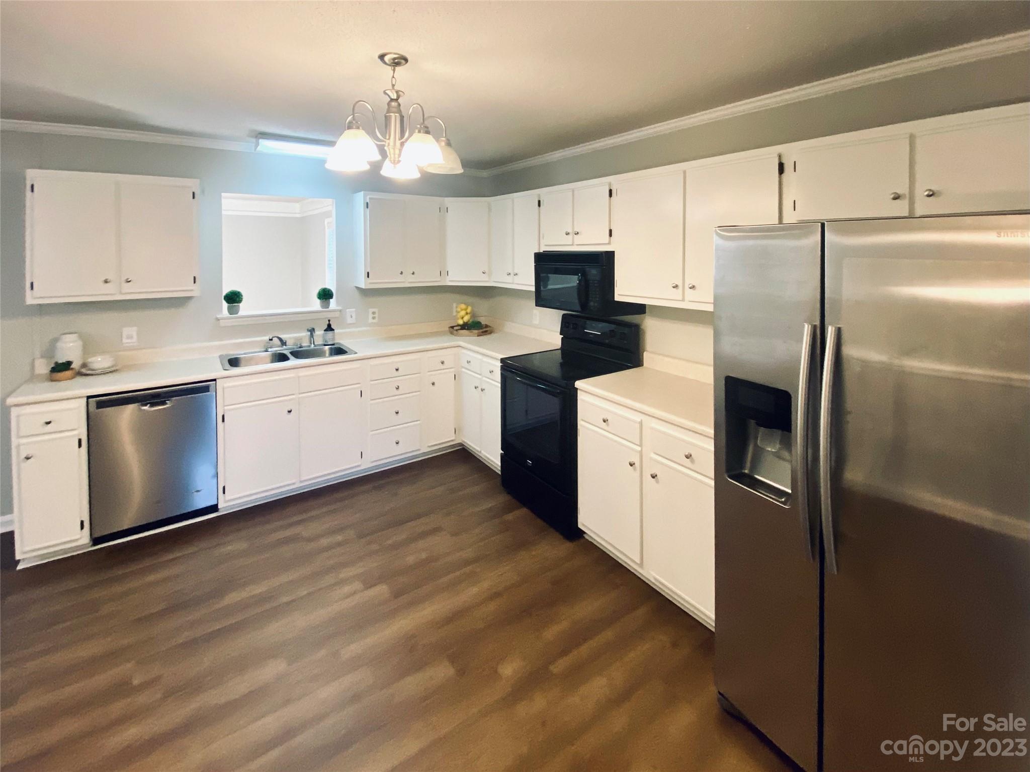 363 Griggs Road Clover, SC 29710 - Photo 1 of 26 a kitchen with white cabinets and stainless steel appliances
