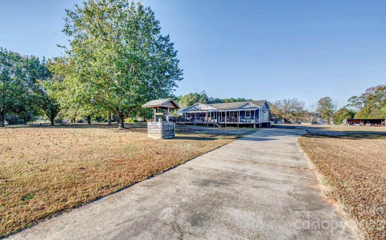 363 Griggs Road Clover, SC 29710 - Photo 2 of 26 a house view with a swimming pool