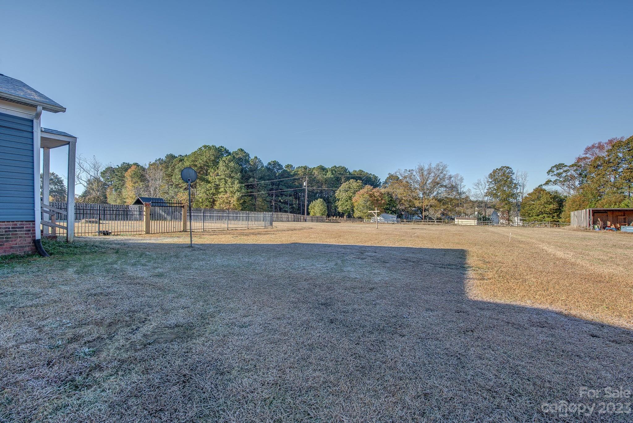 363 Griggs Road Clover, SC 29710 - Photo 21 of 26 a view of a field with trees in the background