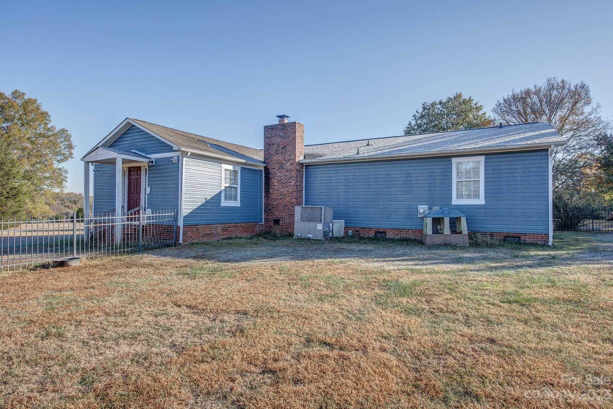 363 Griggs Road Clover, SC 29710 - Photo 24 of 26 a house with trees in the background