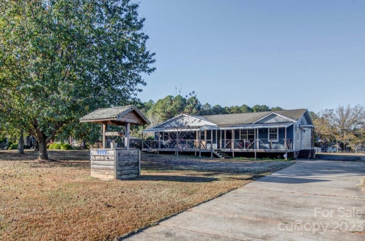 363 Griggs Road Clover, SC 29710 - Photo 26 of 26 a view of a big house with a yard and plants