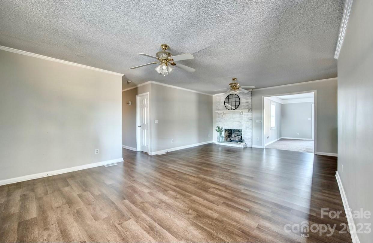 363 Griggs Road Clover, SC 29710 - Photo 7 of 26 wooden floor in an empty room with a window