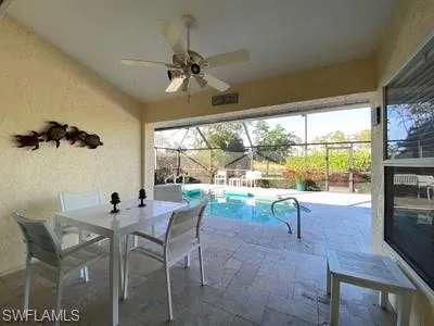 a view of a dining room with furniture window and outside view