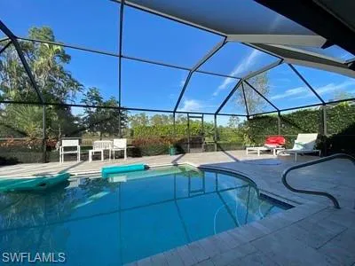 a view of a backyard with sitting area and furniture