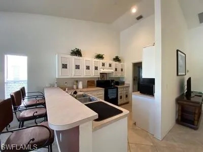 a kitchen that has a table and chairs in it