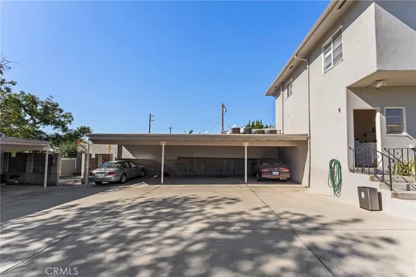 a view of a car park in front of house