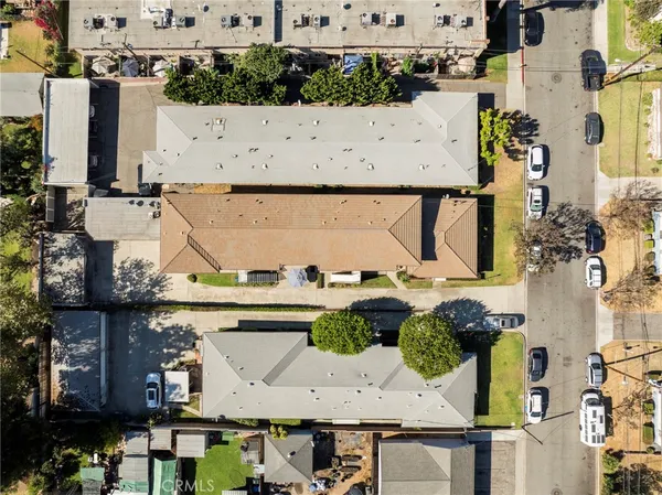 an aerial view of a house with outdoor space