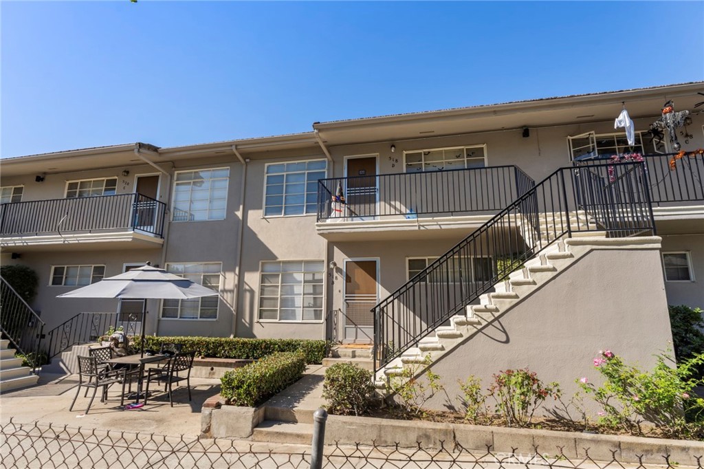 516 Linwood Avenue Monrovia, CA 91016 - Photo 5 of 23 a view of a patio with couches table and chairs with wooden floor and fence