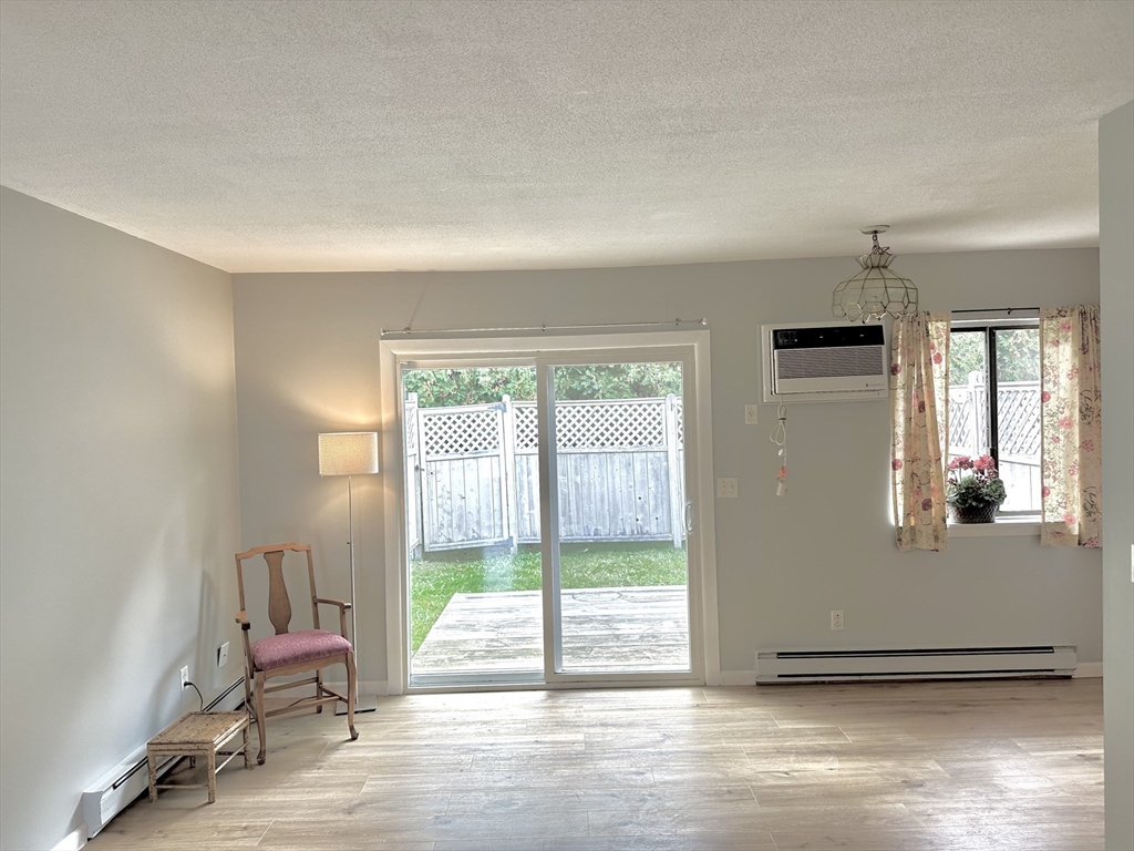 170 East Hadley Road, Unit 11 Amherst, MA 01002 - Photo 13 of 16 a view of a livingroom with furniture and a window