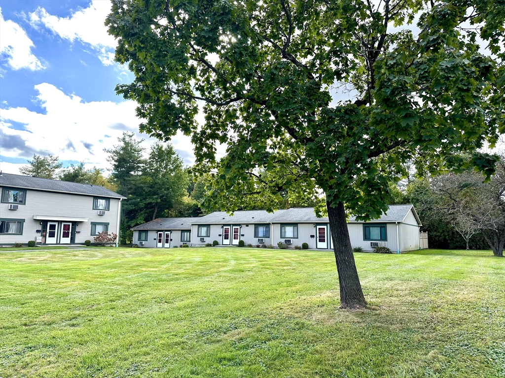 170 East Hadley Road, Unit 11 Amherst, MA 01002 - Photo 2 of 16 a view of a house with a swimming pool
