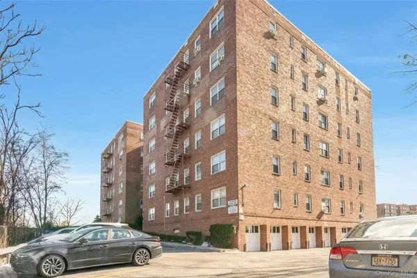 a view of a building and car parked