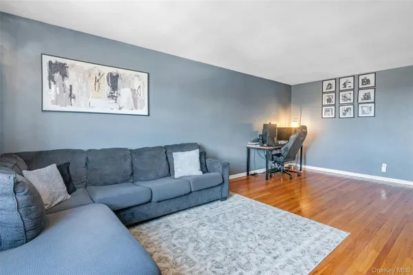 a living room with furniture and a rug
