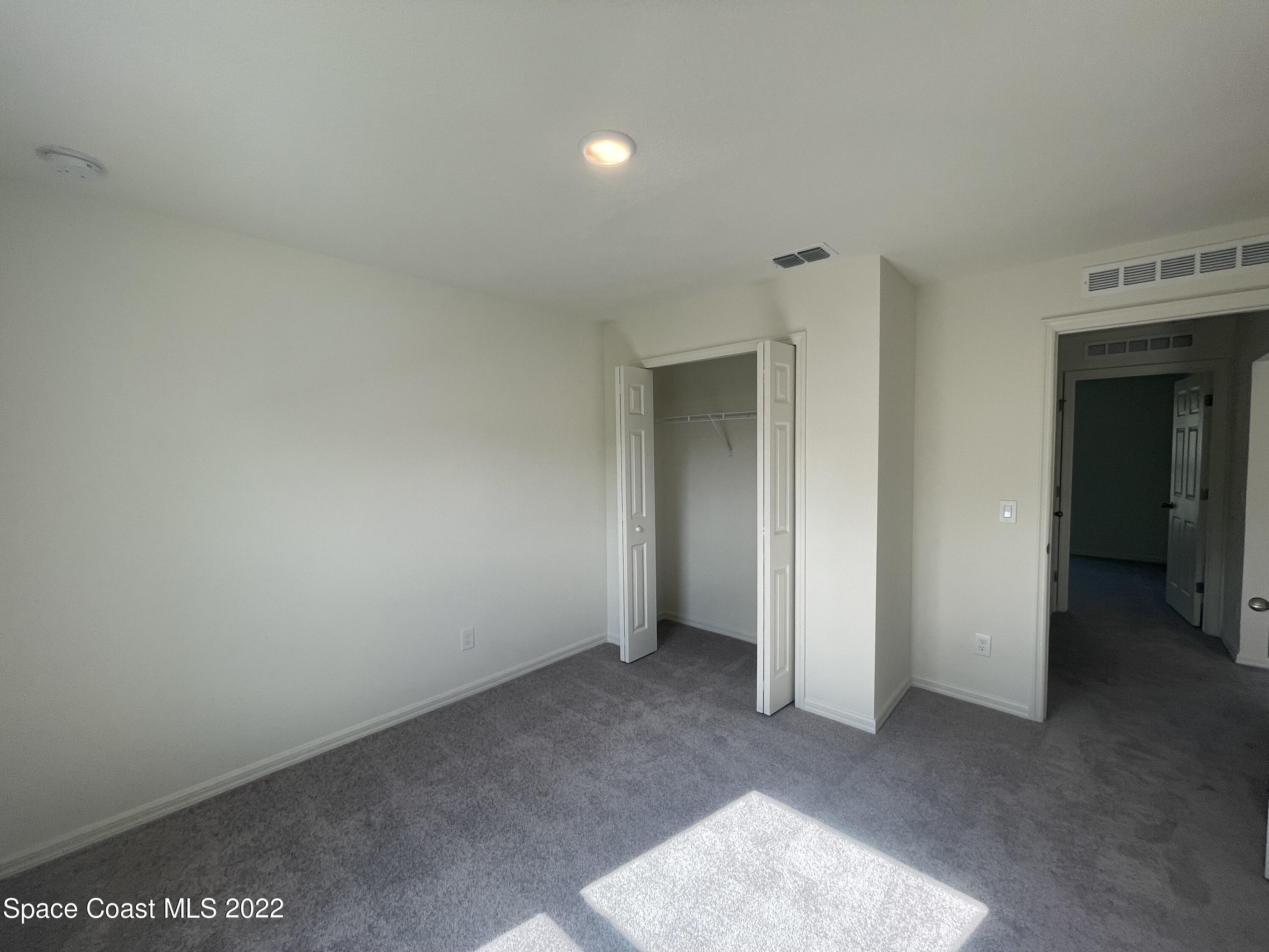 1215 Hastings Road Southwest Palm Bay, FL 32908 - Photo 12 of 16 an empty room with closet