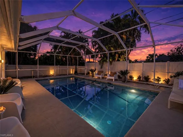 a view of a swimming pool with seating area