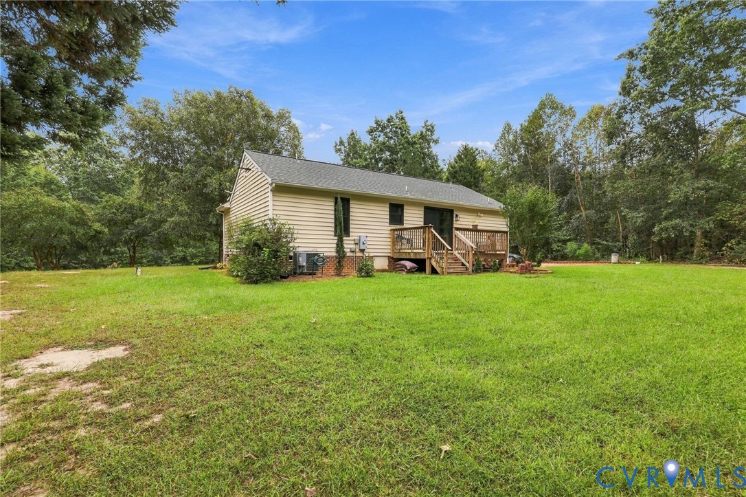 133 Ford Road Bumpass, VA 23024 - Photo 48 of 55 Expansive grass lawn with mature trees and a rear