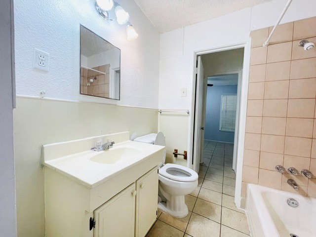 4518 Nicholson Street Corpus Christi, TX 78415 - Photo 11 of 32 a bathroom with a sink toilet and shower