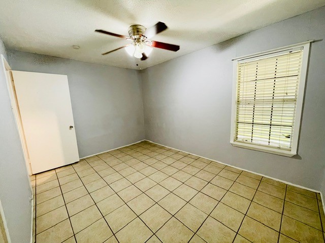 4518 Nicholson Street Corpus Christi, TX 78415 - Photo 14 of 32 an empty room with windows