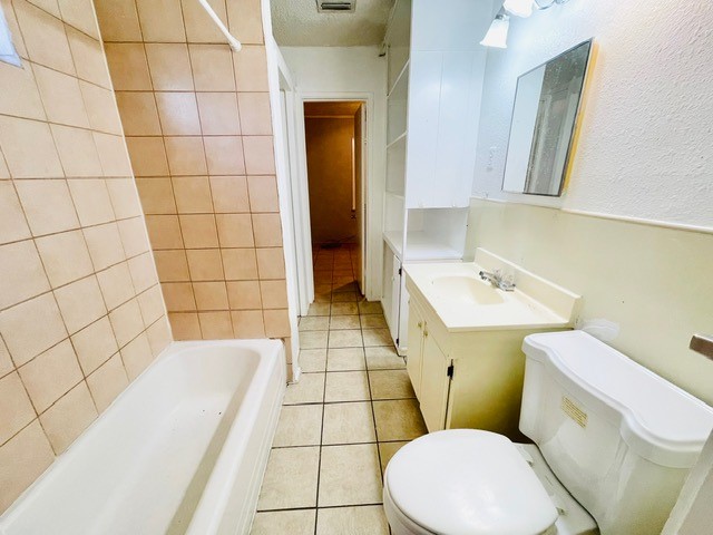 4518 Nicholson Street Corpus Christi, TX 78415 - Photo 15 of 32 a bathroom with a sink a toilet and mirror