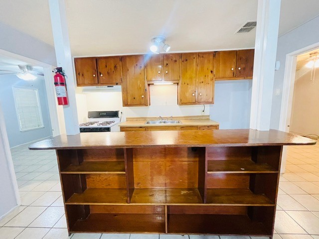 4518 Nicholson Street Corpus Christi, TX 78415 - Photo 18 of 32 a room with stainless steel appliances wooden floor and view kitchen