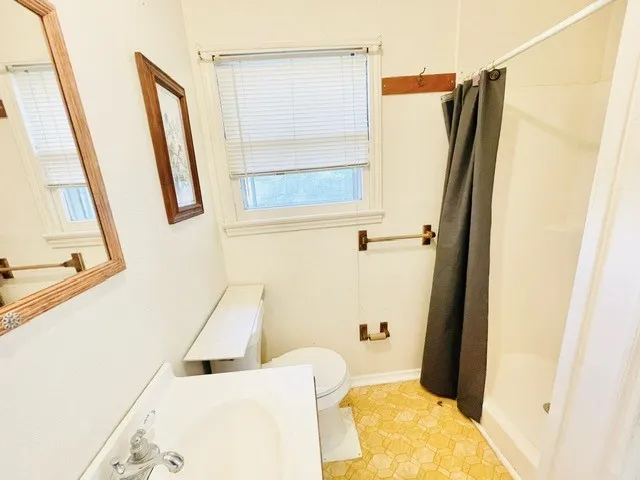 a room with a sink and cabinets