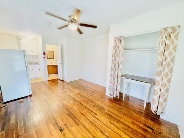 4518 Nicholson Street Corpus Christi, TX 78415 - Photo 26 of 32 a view of a livingroom with wooden floor and a ceiling fan