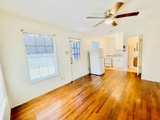a kitchen with a refrigerator and a sink