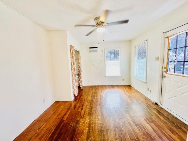 4518 Nicholson Street Corpus Christi, TX 78415 - Photo 28 of 32 wooden floor in an empty room with a window