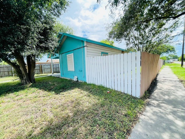 4518 Nicholson Street Corpus Christi, TX 78415 - Photo 3 of 32 a view of backyard with large trees and wooden fence