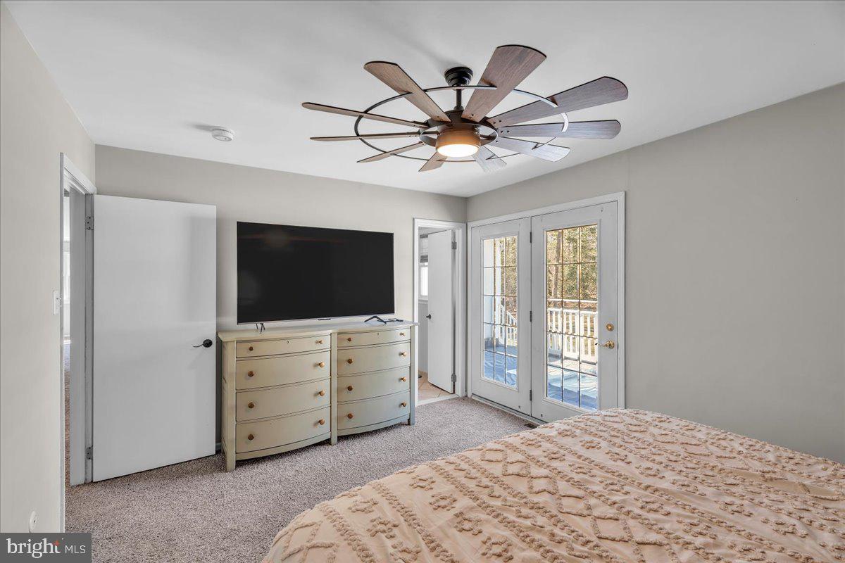 97 3 Bridge Road Shamong, NJ 08088 - Photo 16 of 45 a bedroom with a bed and a flat screen tv