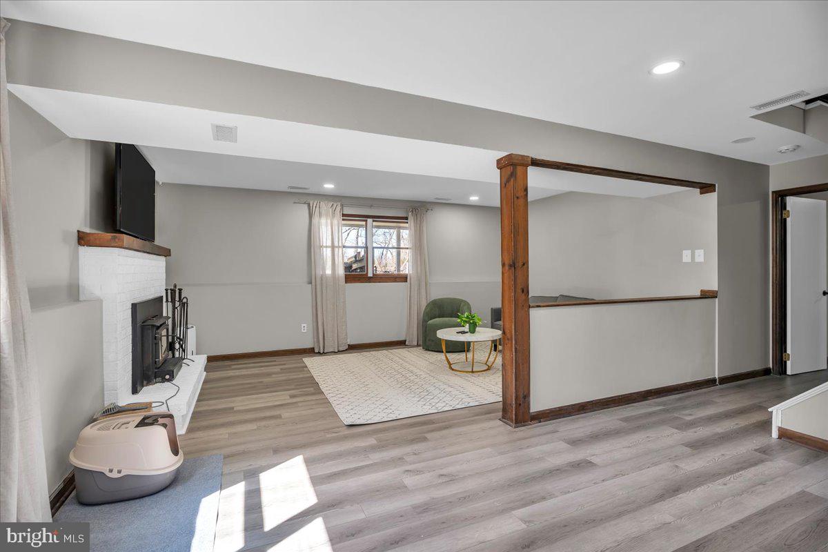 97 3 Bridge Road Shamong, NJ 08088 - Photo 26 of 45 a view of a livingroom with furniture and a fireplace