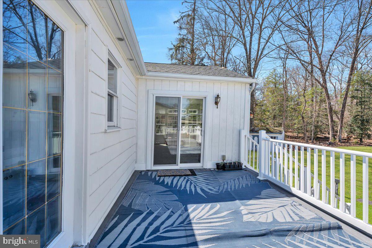 97 3 Bridge Road Shamong, NJ 08088 - Photo 31 of 45 a view of a deck with wooden floor and fence