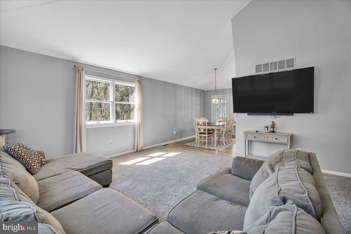 97 3 Bridge Road Shamong, NJ 08088 - Photo 7 of 45 a living room with furniture and a flat screen tv