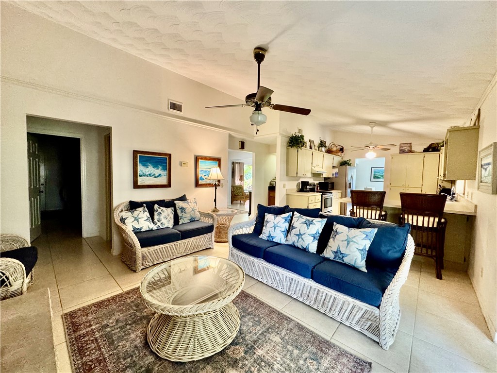 1946 Surfside Terrace Vero Beach, FL 32963 - Photo 13 of 36 a living room with furniture and a chandelier