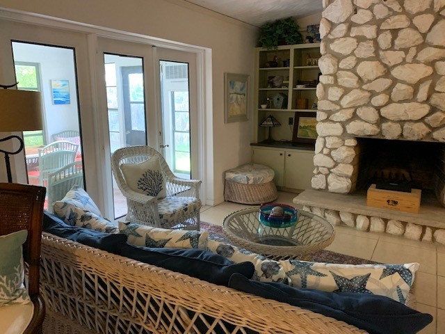 1946 Surfside Terrace Vero Beach, FL 32963 - Photo 14 of 36 a living room with furniture and a fireplace