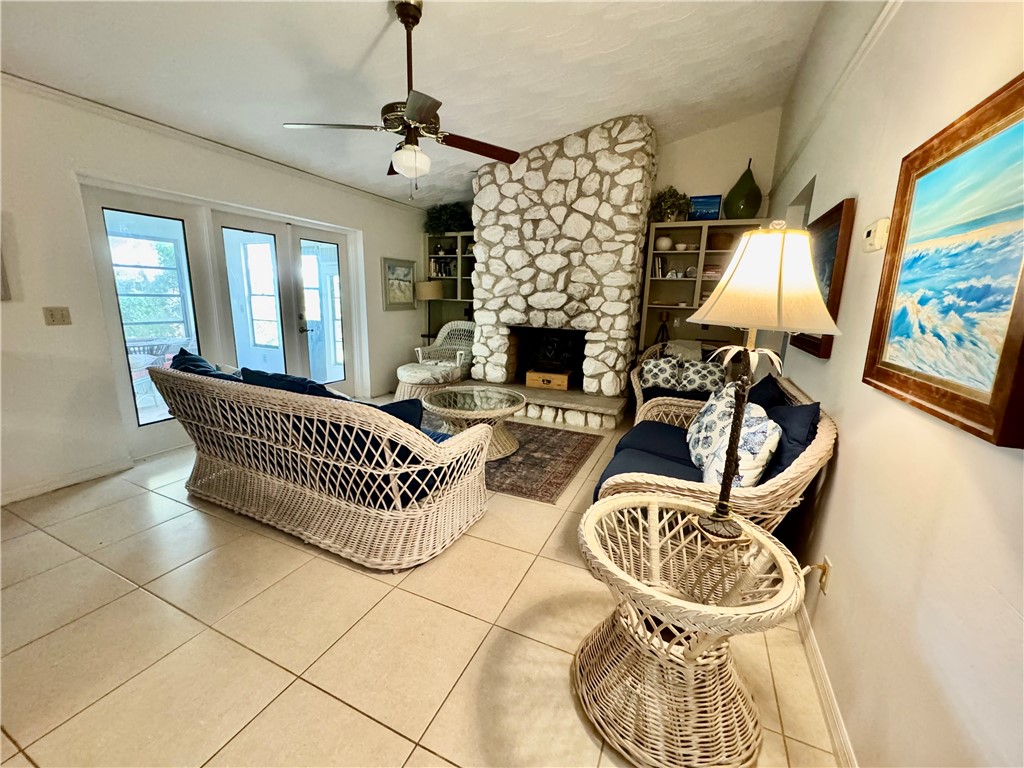 1946 Surfside Terrace Vero Beach, FL 32963 - Photo 17 of 36 a living room with furniture a chandelier and a rug