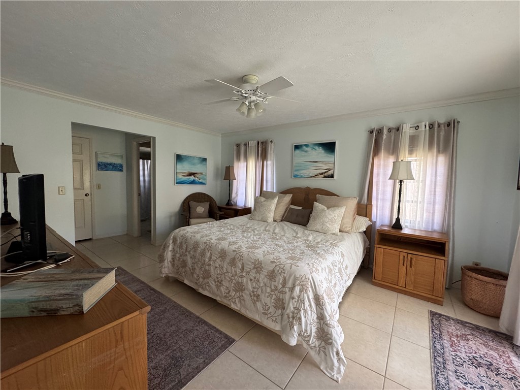 1946 Surfside Terrace Vero Beach, FL 32963 - Photo 19 of 36 a bed room with a bed and a television