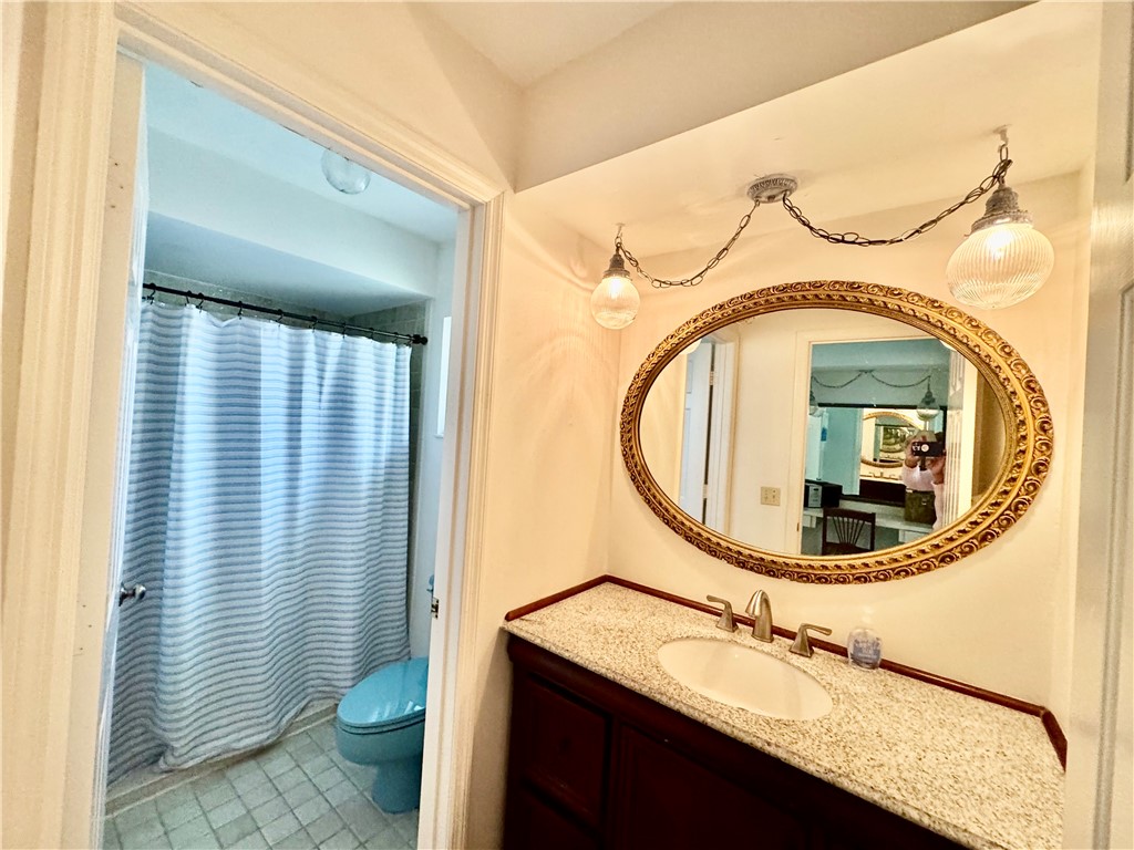 1946 Surfside Terrace Vero Beach, FL 32963 - Photo 22 of 36 a bathroom with a sink and a mirror