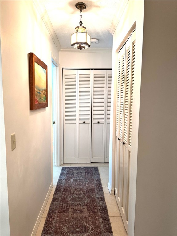 1946 Surfside Terrace Vero Beach, FL 32963 - Photo 29 of 36 a view of a hallway with wooden floor and chandelier