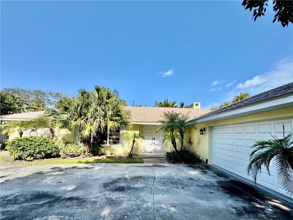 1946 Surfside Terrace Vero Beach, FL 32963 - Photo 36 of 36 a front view of a house with a yard