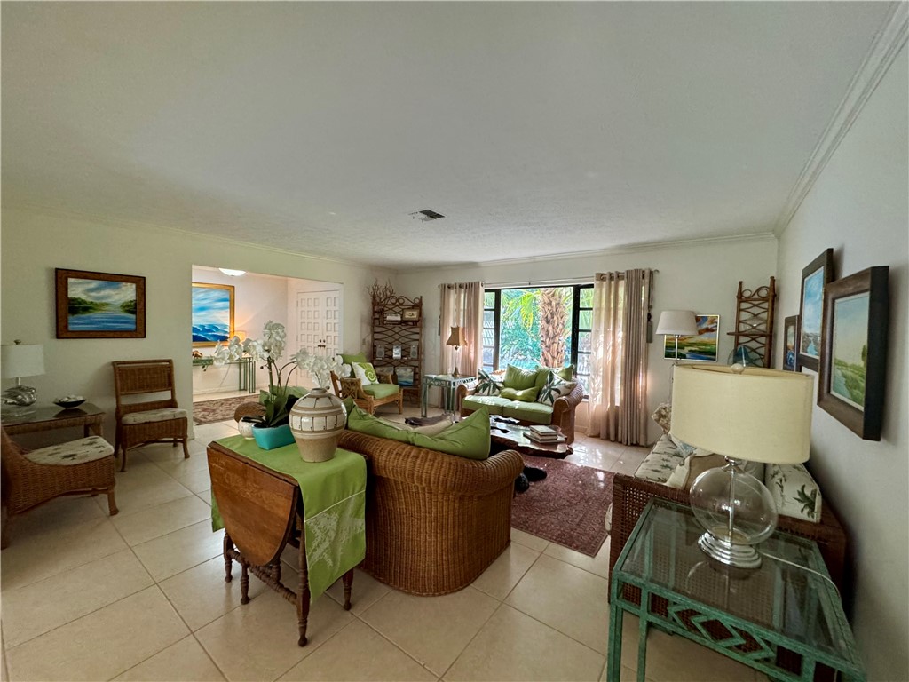 1946 Surfside Terrace Vero Beach, FL 32963 - Photo 5 of 36 a living room with furniture fireplace and flat screen tv